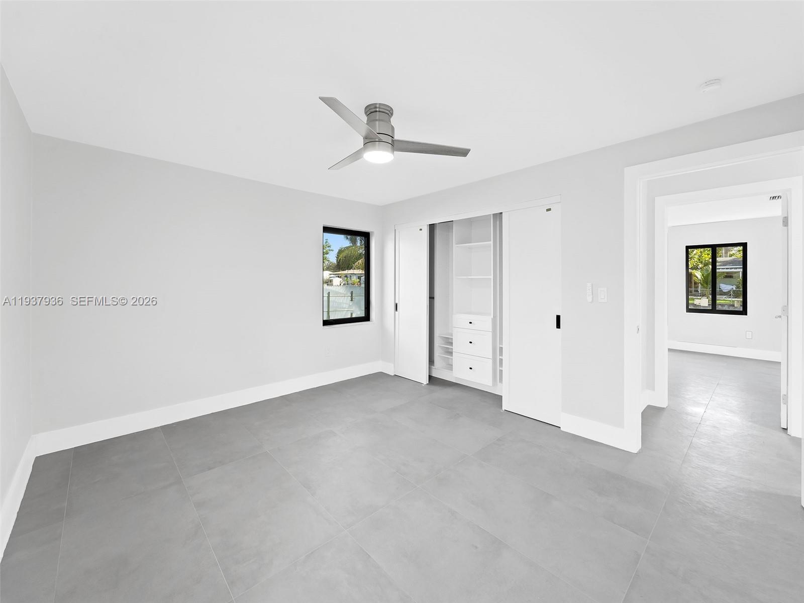 212 Southwest 7th Street Hallandale Beach, FL 33009 - Photo 10 of 23 a view of an empty room with a window