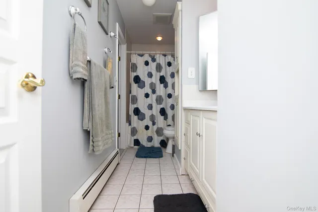 a bathroom with a toilet and a sink