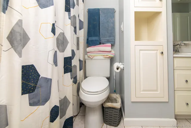 a bedroom with a bed and a television