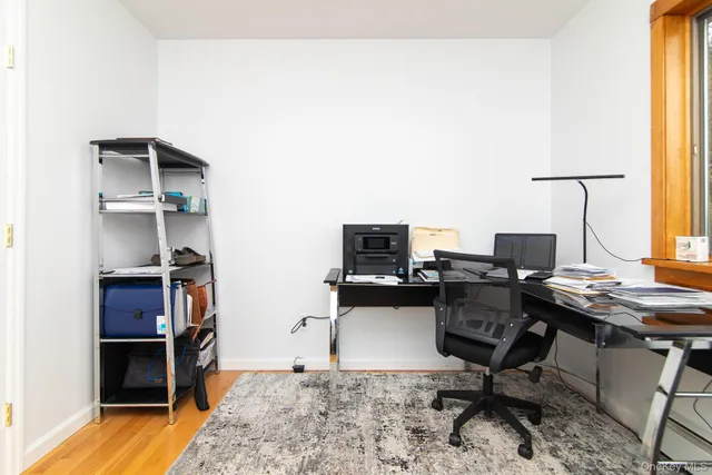 a view of an entryway with wooden floor