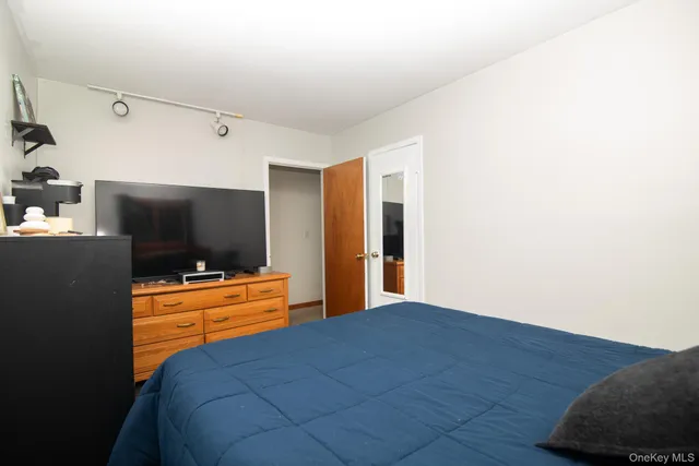 a bathroom with a sink a mirror and shower