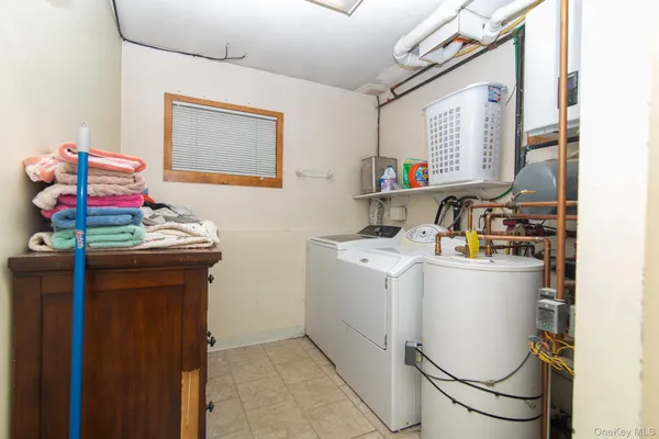a view of a chair and table in backyard of the house