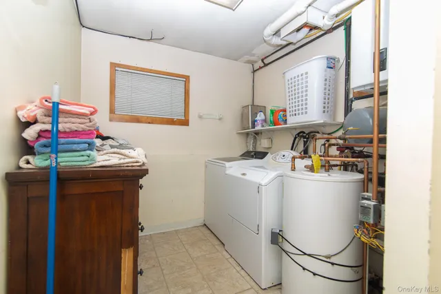 a view of a chair and table in backyard of the house