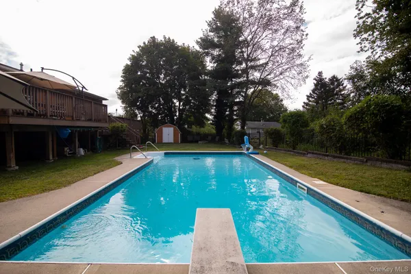 a view of a balcony with wooden floor