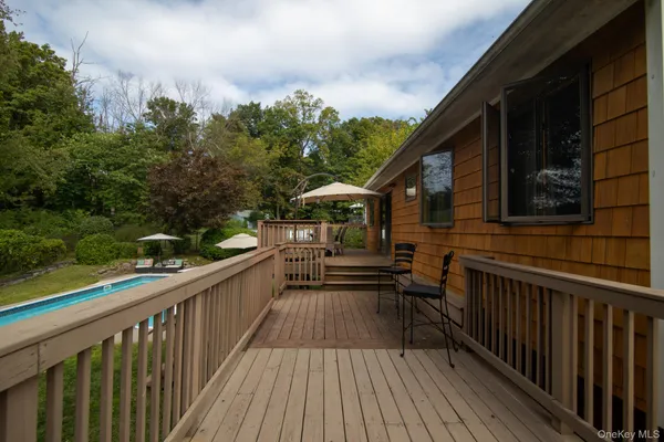 a view of a house with pool and trees