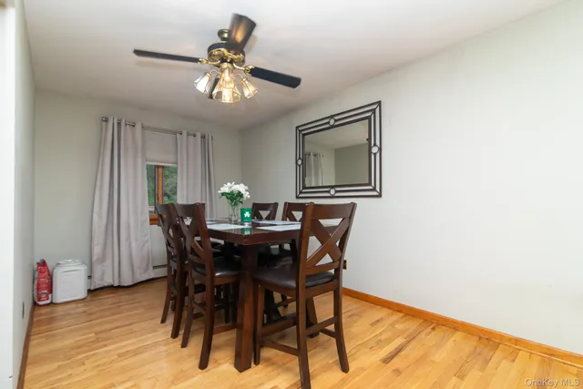 a view of a dining room with furniture and chandelier