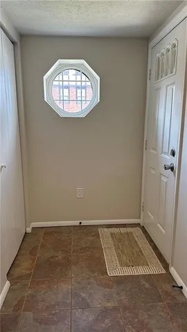 an empty room with a empty space and a window