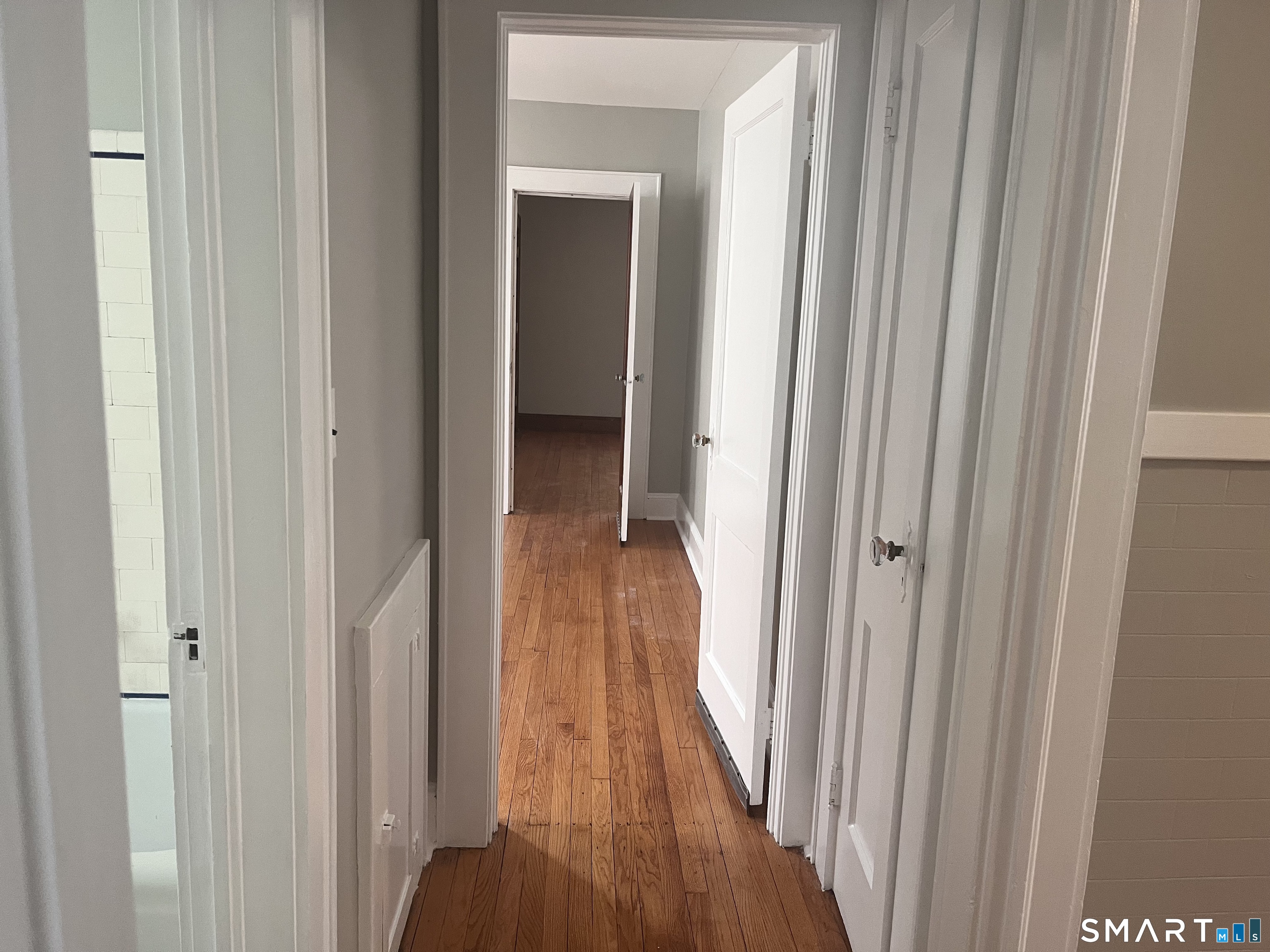 460 Anson Street Bridgeport, CT 06606 - Photo 18 of 24 a view of a hallway with wooden floor