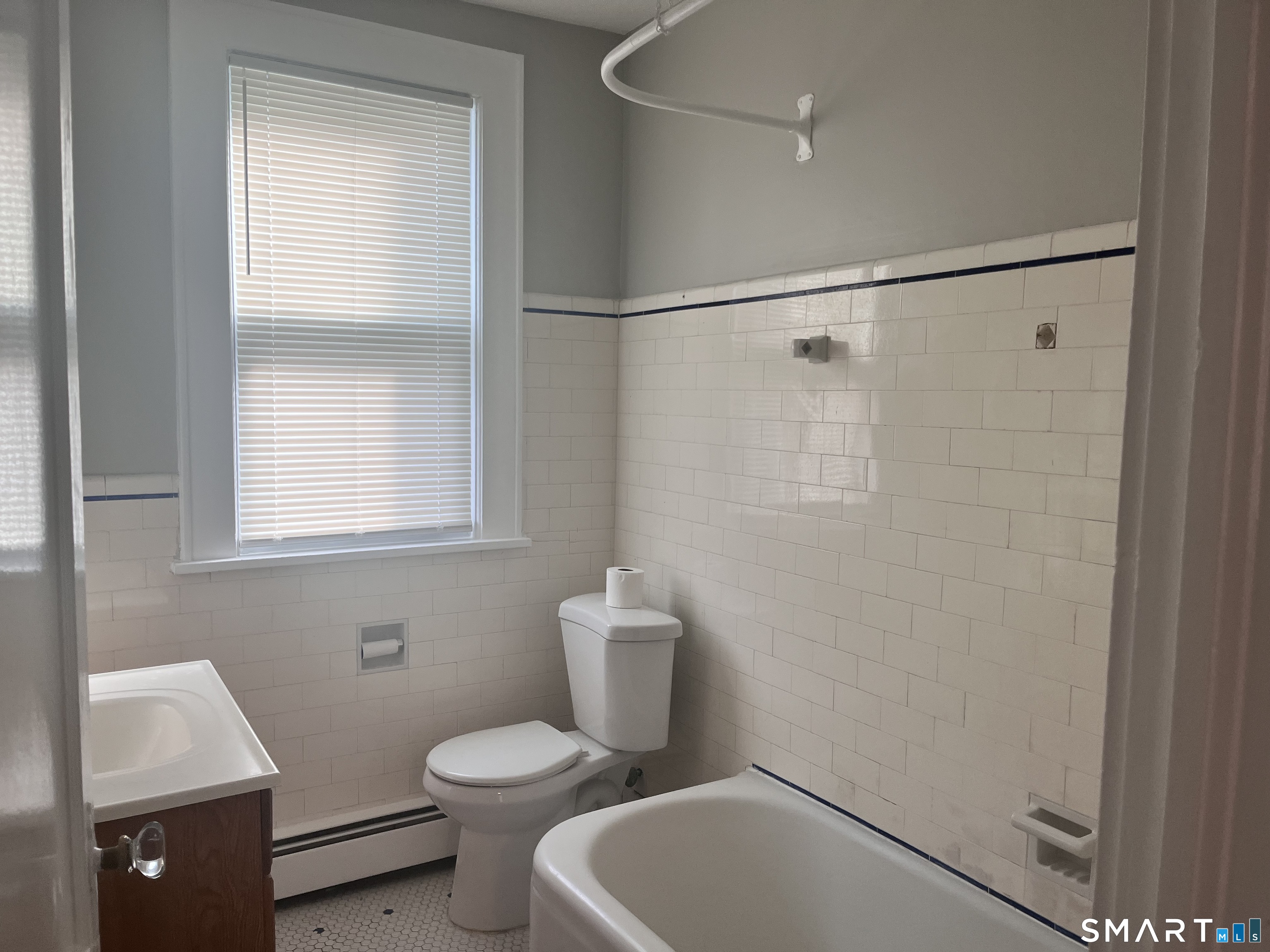 460 Anson Street Bridgeport, CT 06606 - Photo 19 of 24 a bathroom with a toilet a sink and shower