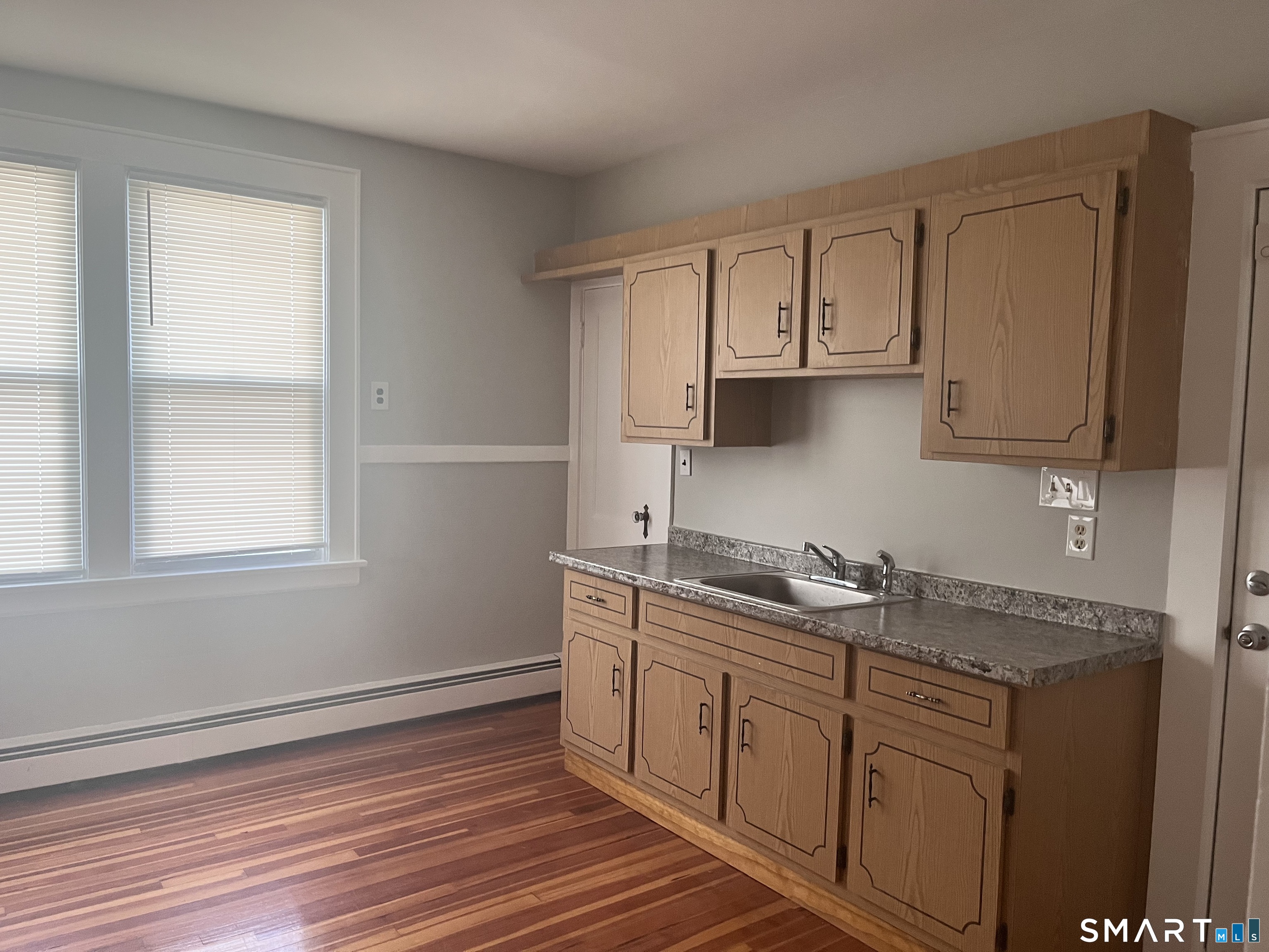 460 Anson Street Bridgeport, CT 06606 - Photo 6 of 24 a kitchen with stainless steel appliances granite countertop a sink stove and cabinets
