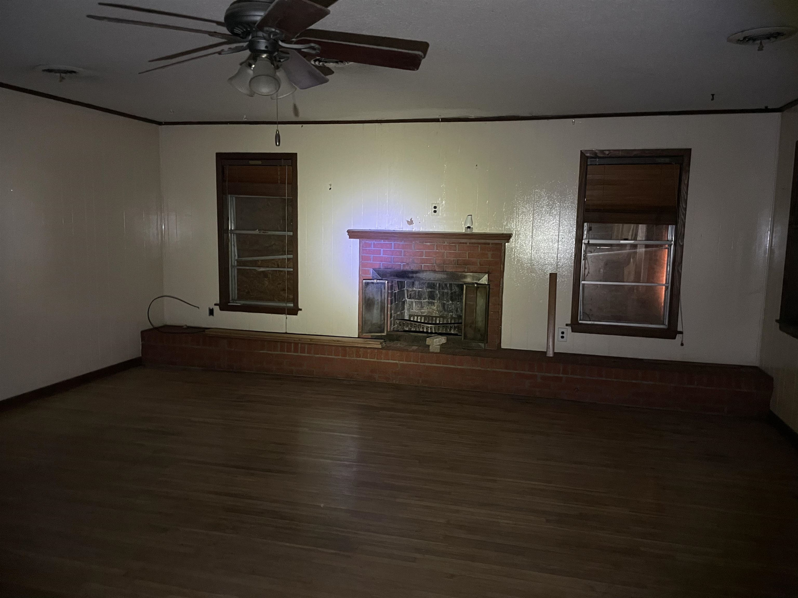 1511 Welsh Road Memphis, TN 38117 - Photo 3 of 7 a view of empty room with wooden floor and fan