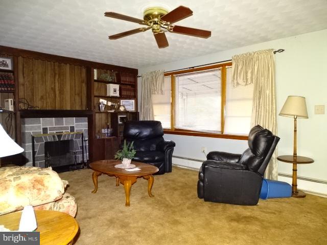 2281 Blackberry Road Dover, PA 17315 - Photo 10 of 29 a living room with furniture a fireplace and a large window