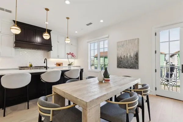 a kitchen with a sink cabinets and window