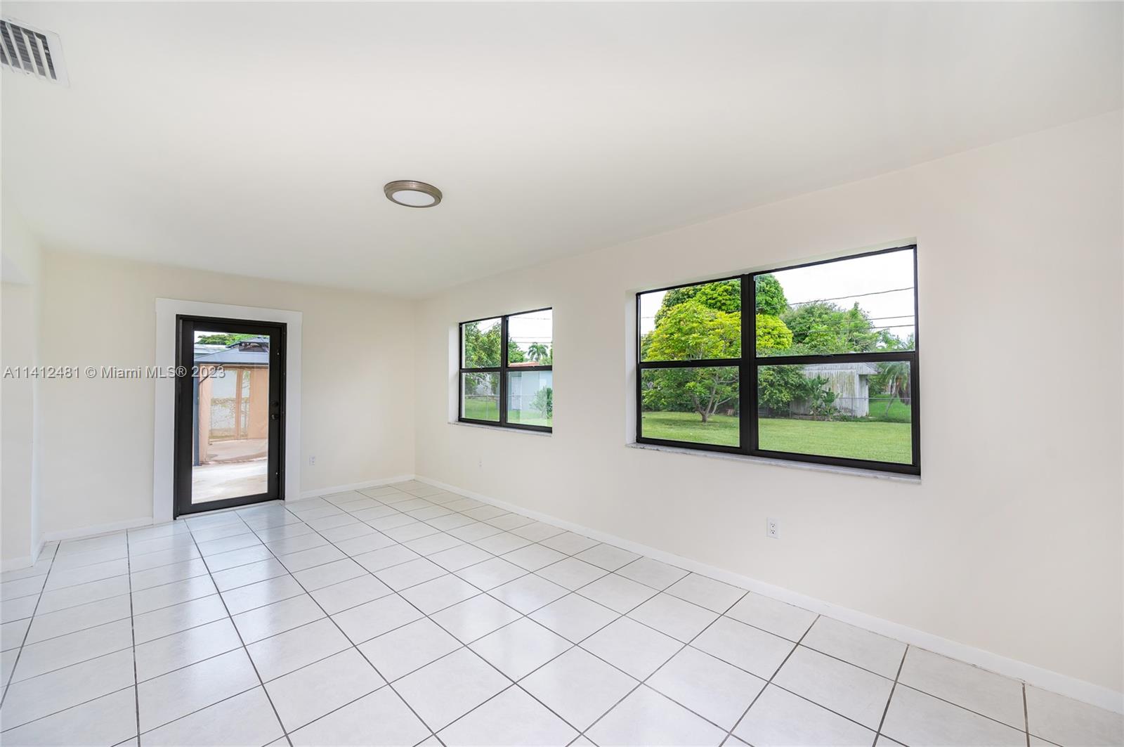 532 Northwest 15th Street Homestead, FL 33030 - Photo 12 of 32 an empty room with windows