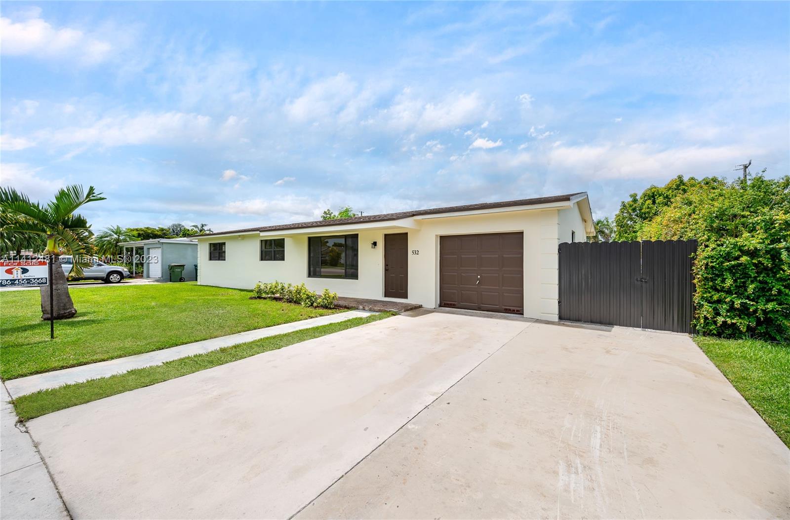 532 Northwest 15th Street Homestead, FL 33030 - Photo 2 of 32 a front view of house with yard and green space