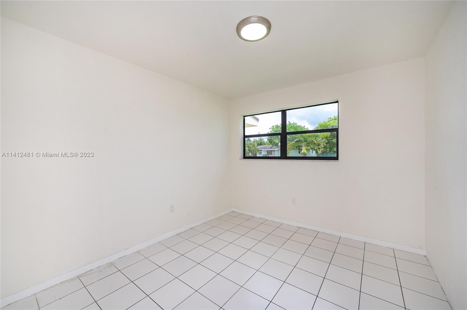 532 Northwest 15th Street Homestead, FL 33030 - Photo 23 of 32 an empty room with windows