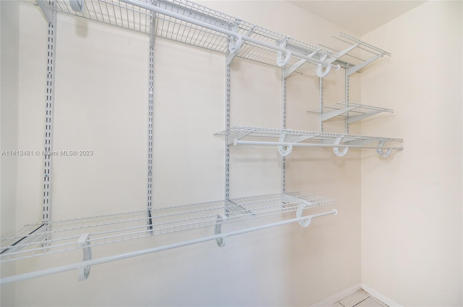 532 Northwest 15th Street Homestead, FL 33030 - Photo 27 of 32 a view of a room with racks on the wall