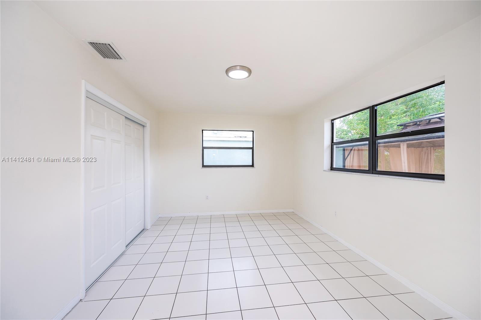 532 Northwest 15th Street Homestead, FL 33030 - Photo 28 of 32 a view of an empty room and window
