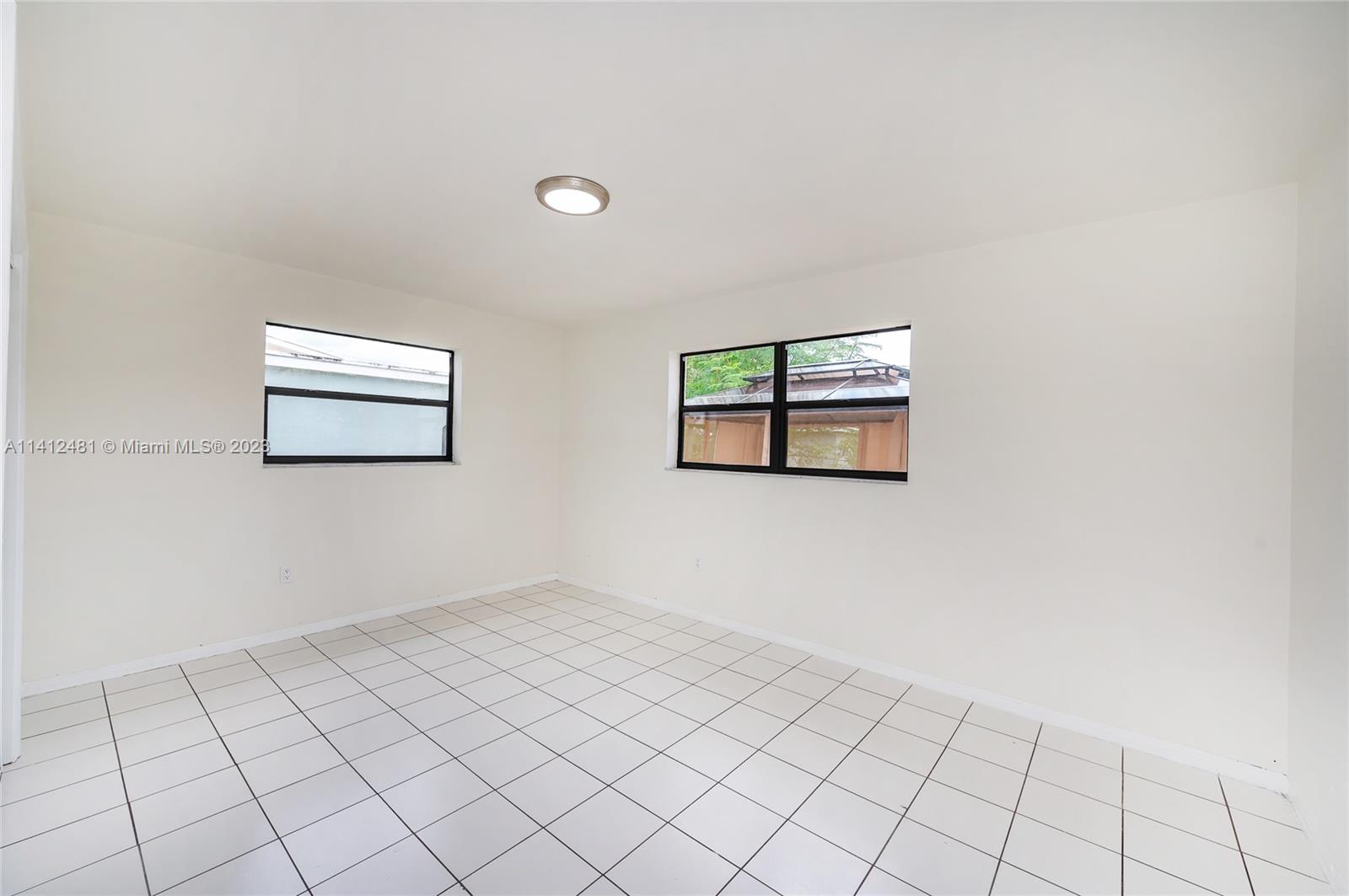 532 Northwest 15th Street Homestead, FL 33030 - Photo 29 of 32 a view of an empty room with windows