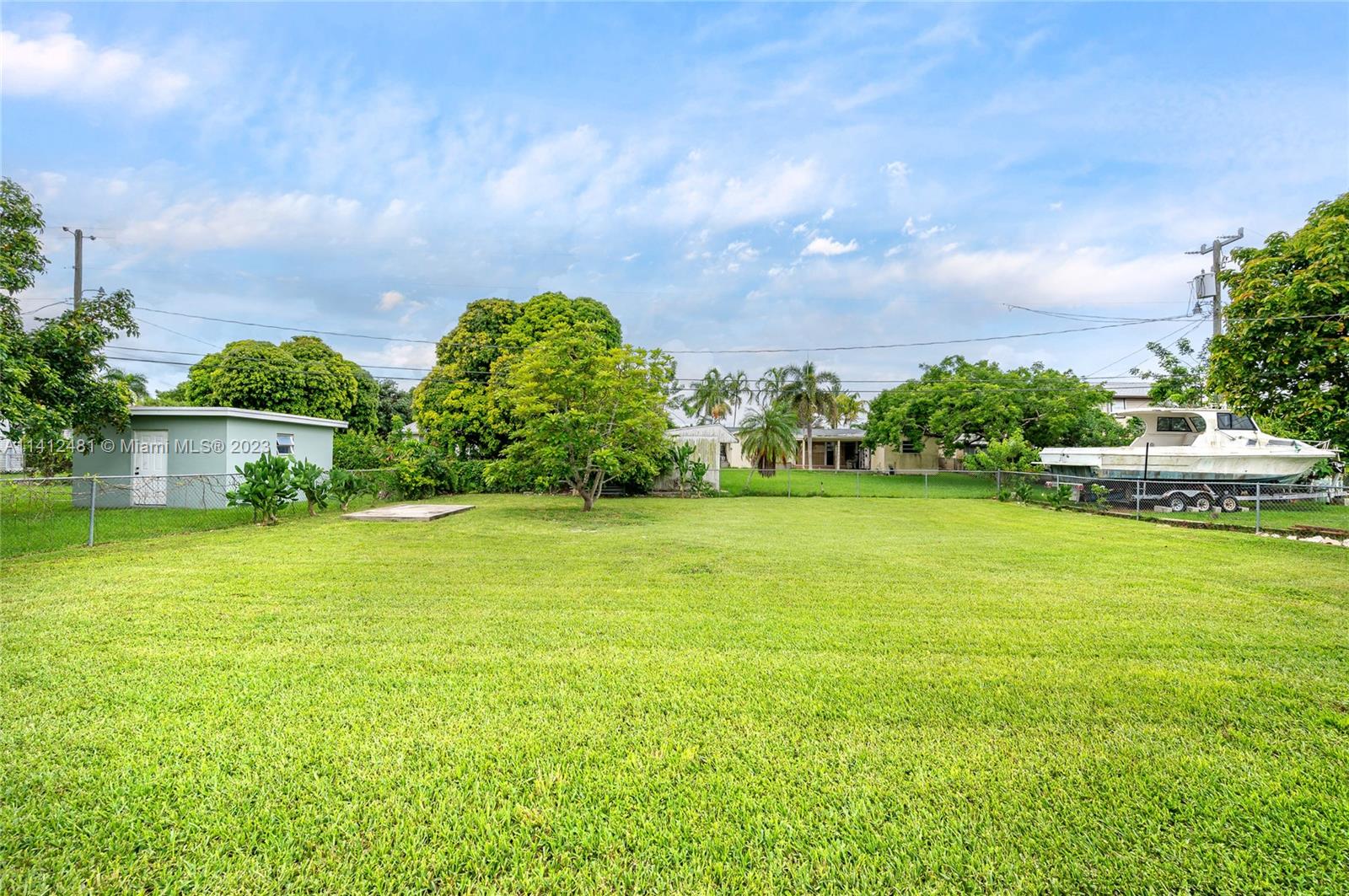 532 Northwest 15th Street Homestead, FL 33030 - Photo 3 of 32 a view of a garden with a building in the background