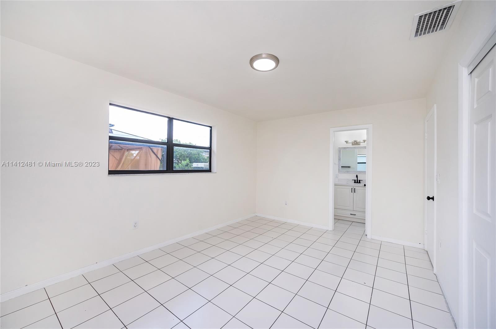 532 Northwest 15th Street Homestead, FL 33030 - Photo 31 of 32 a view of an empty room and window