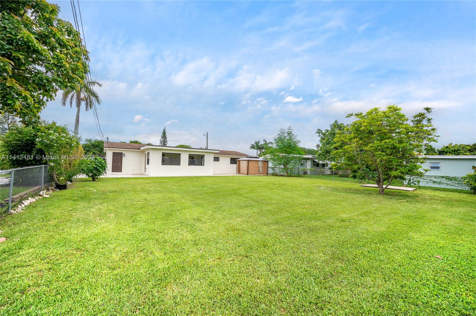 532 Northwest 15th Street Homestead, FL 33030 - Photo 4 of 32 a front view of a house with a garden