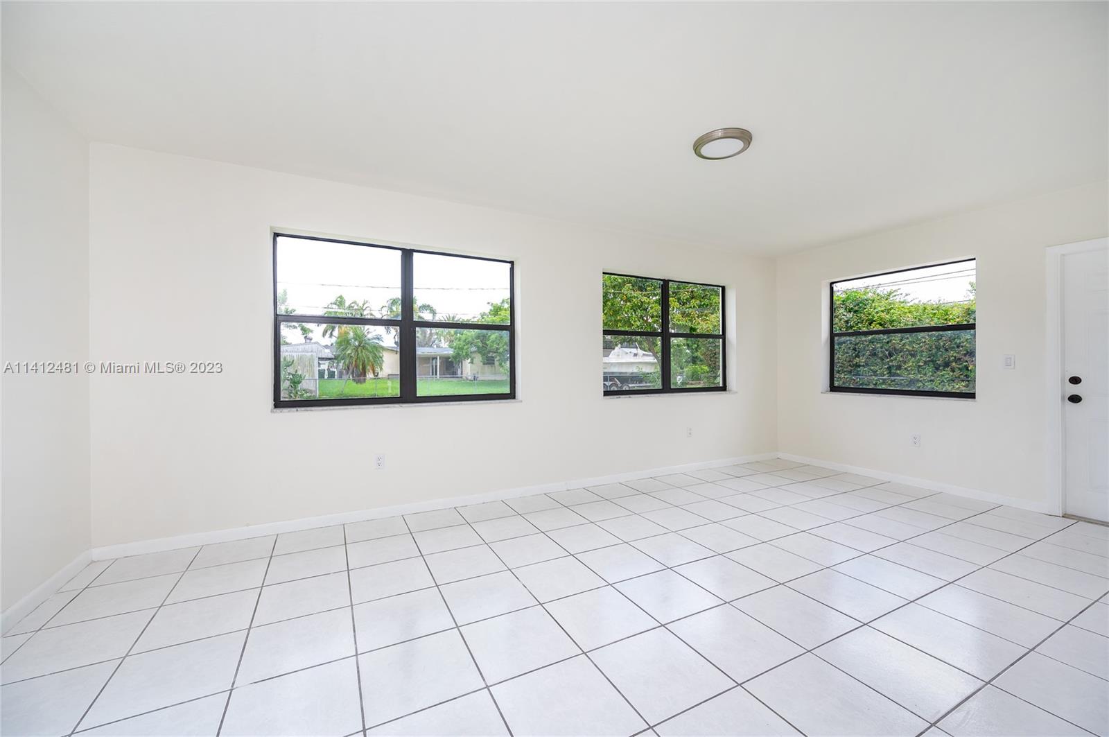 532 Northwest 15th Street Homestead, FL 33030 - Photo 10 of 32 a view of an empty room and window