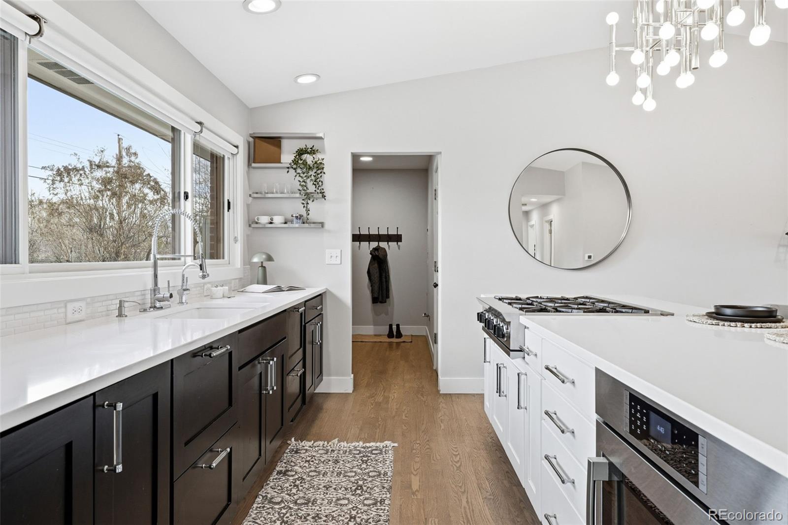 5320 Vale Drive Denver, CO 80246 - Photo 15 of 47 a spacious bathroom with a double vanity sink and a mirror