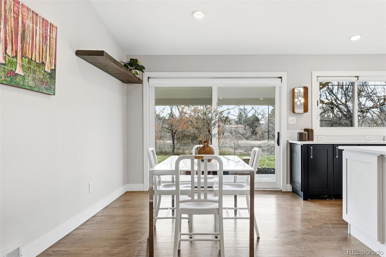 5320 Vale Drive Denver, CO 80246 - Photo 16 of 47 a view of a dining room with furniture window and outside view
