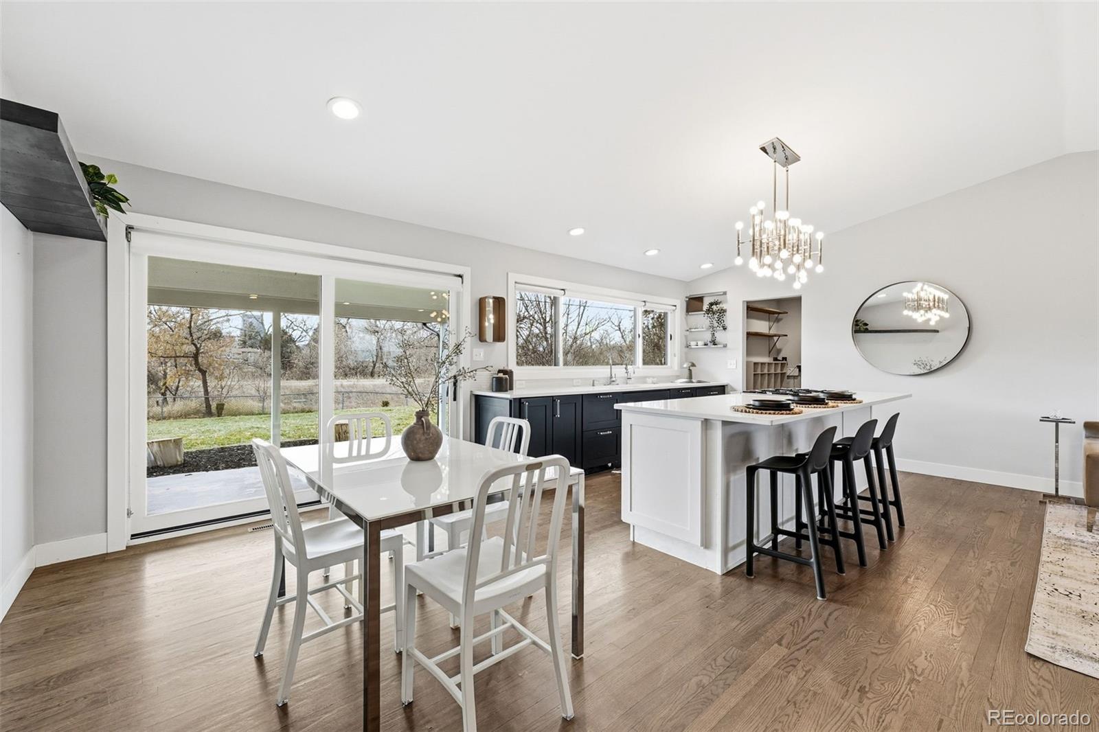 5320 Vale Drive Denver, CO 80246 - Photo 17 of 47 a view of a dining room with furniture window and wooden floor