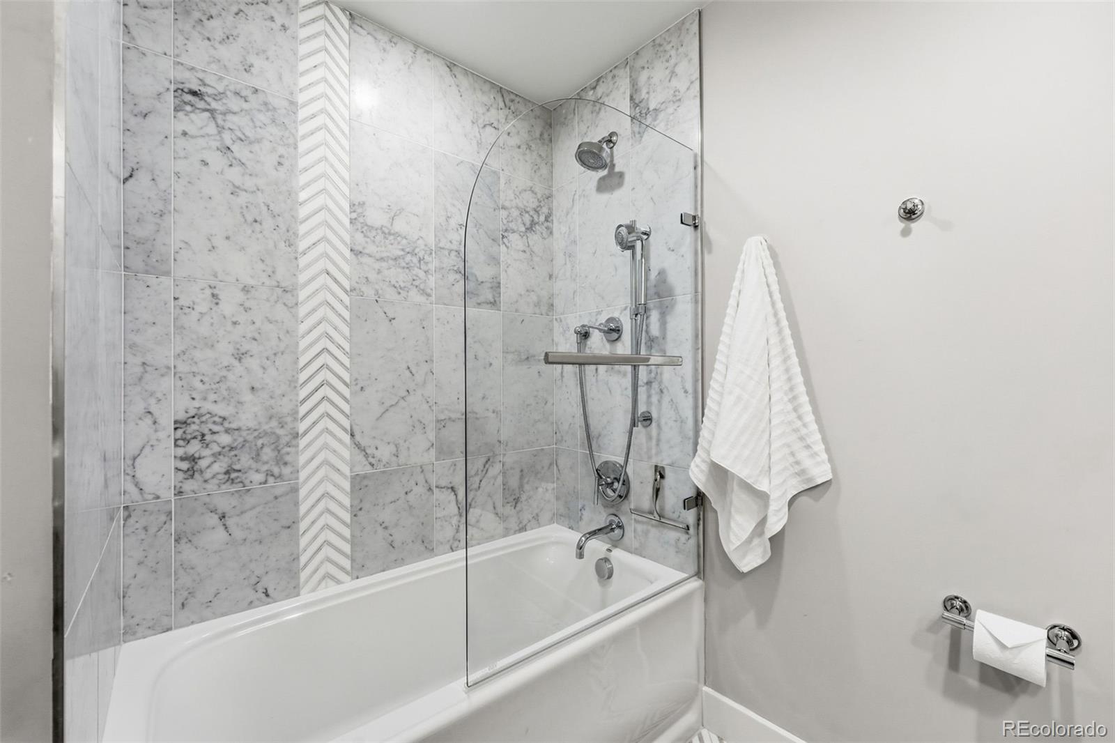 5320 Vale Drive Denver, CO 80246 - Photo 25 of 47 a bathroom with a shower and a bath tub