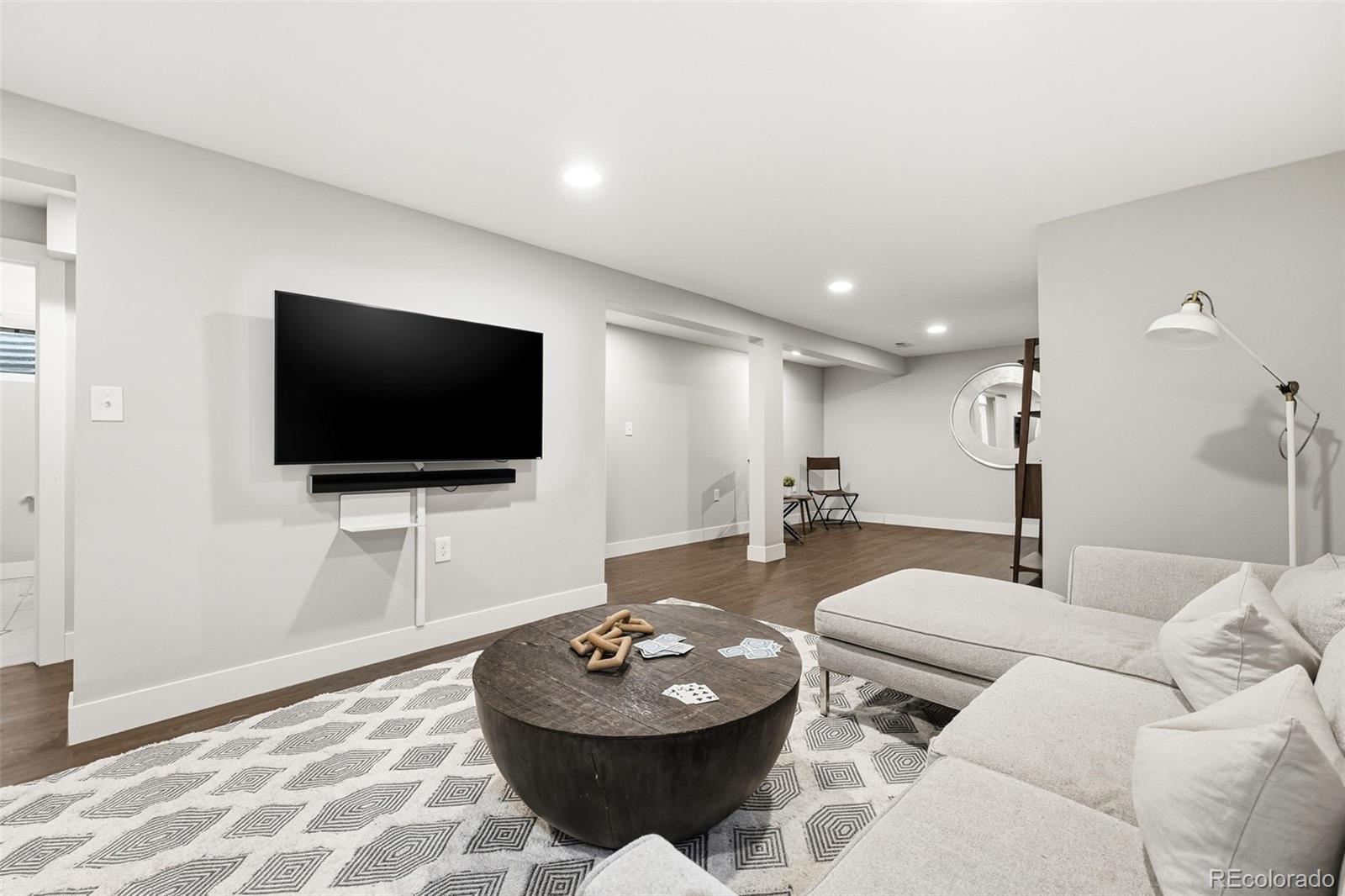 5320 Vale Drive Denver, CO 80246 - Photo 28 of 47 a living room with furniture and a flat screen tv
