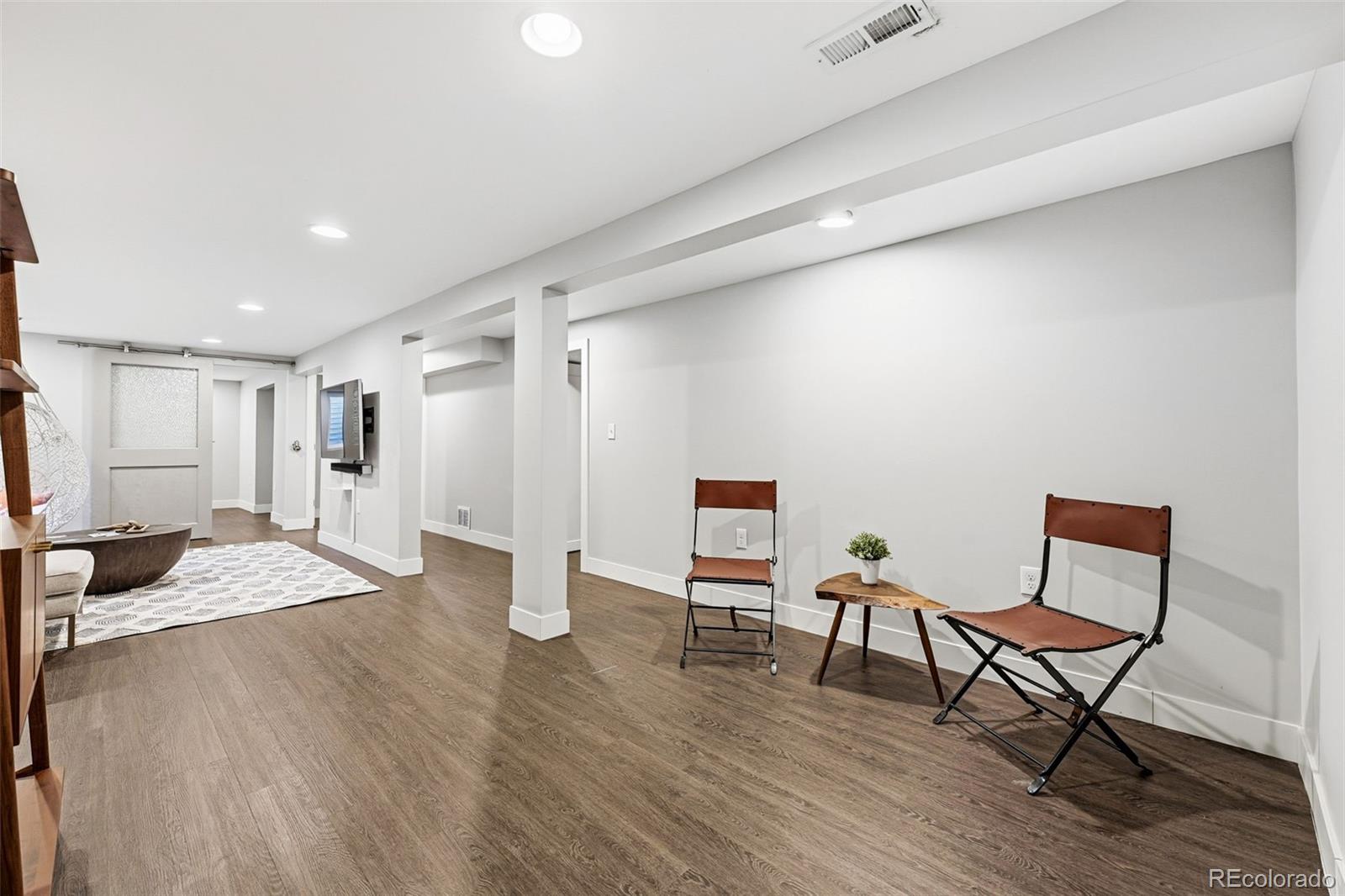 5320 Vale Drive Denver, CO 80246 - Photo 32 of 47 a open kitchen with white cabinets and stainless steel appliances