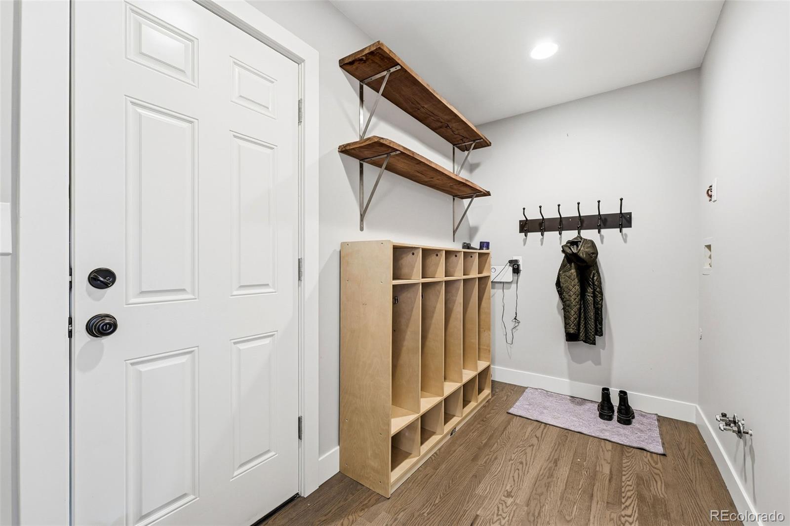 5320 Vale Drive Denver, CO 80246 - Photo 35 of 47 a walk in closet with wooden floor
