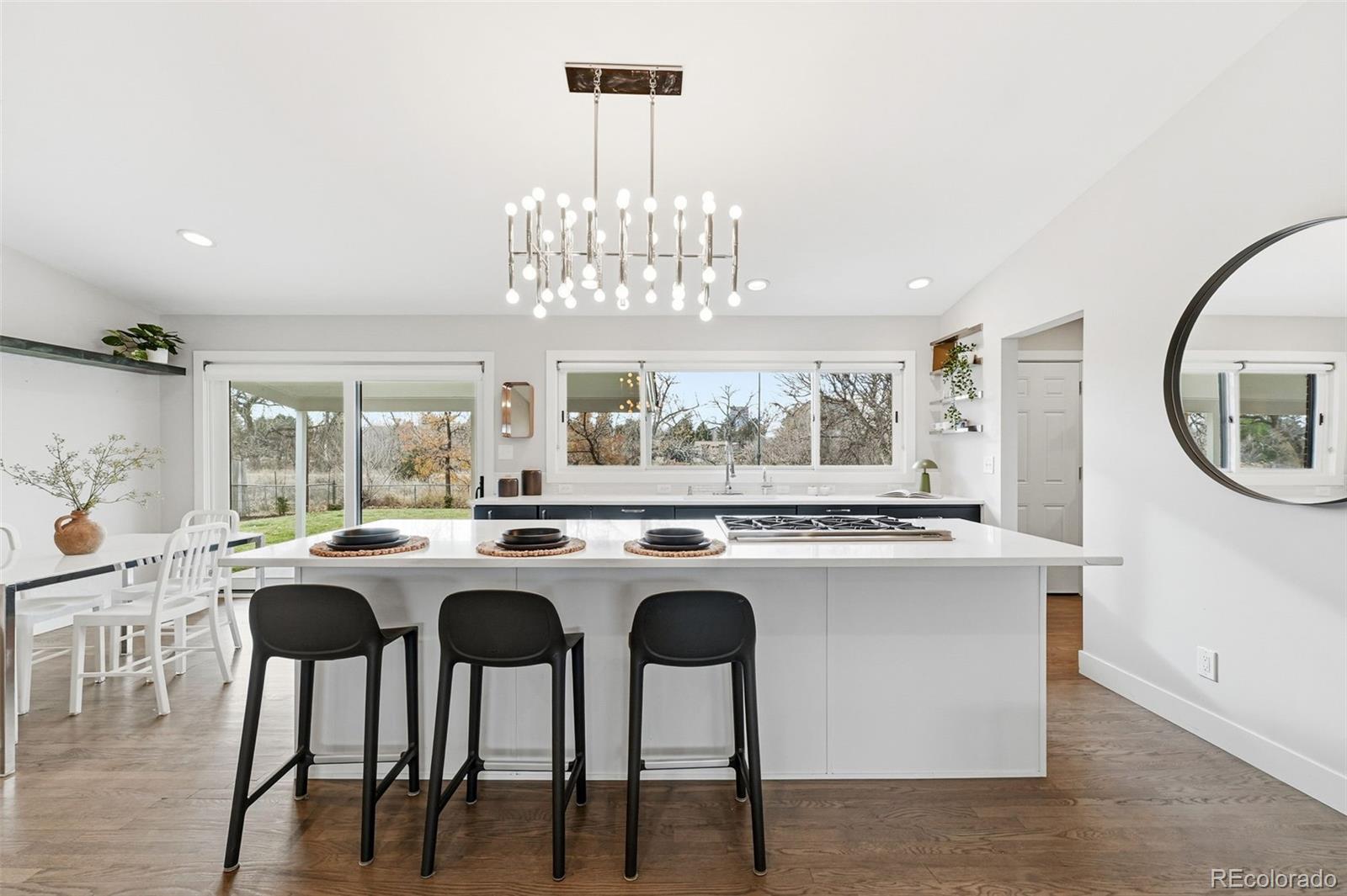 5320 Vale Drive Denver, CO 80246 - Photo 10 of 47 a kitchen with stove a table and chairs