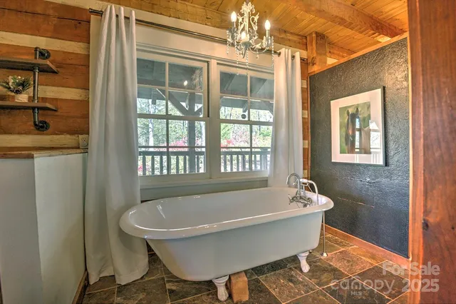 a white bath tub sitting next to a window