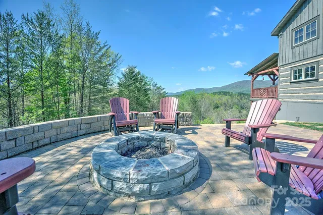 a view of a house with a yard and furniture