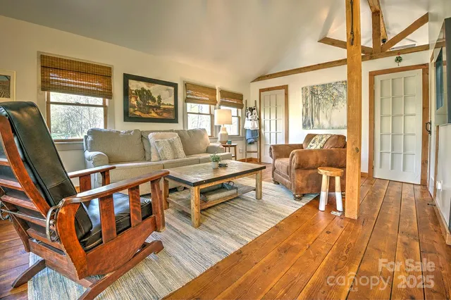 a living room with furniture and a table