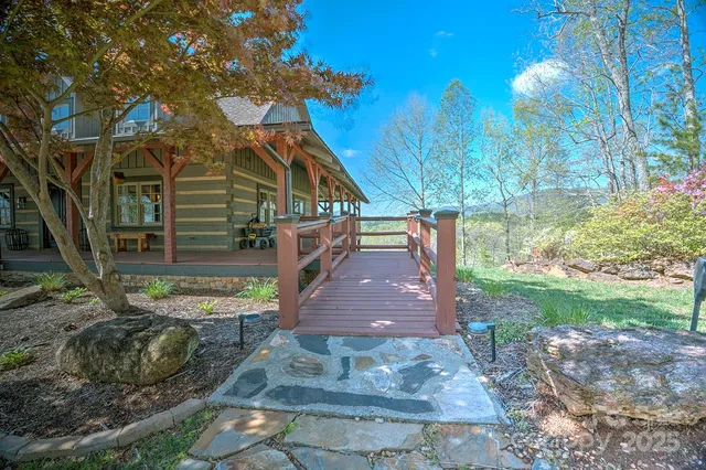 an aerial view of a house with a yard basket ball court and outdoor seating
