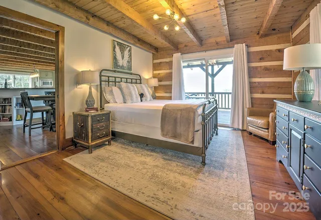 a living room with a couch next to a window with outer view