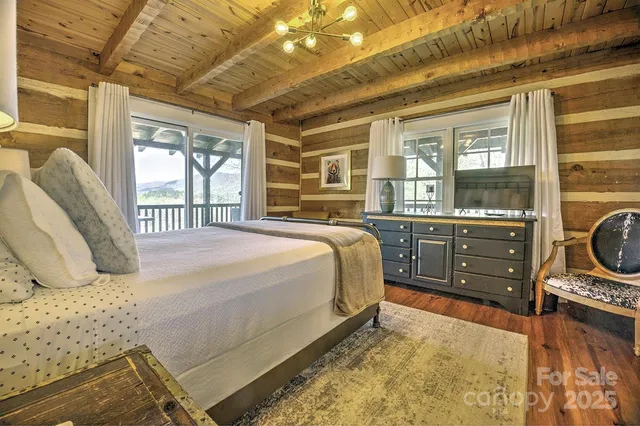 a bedroom with a bed dresser and a window