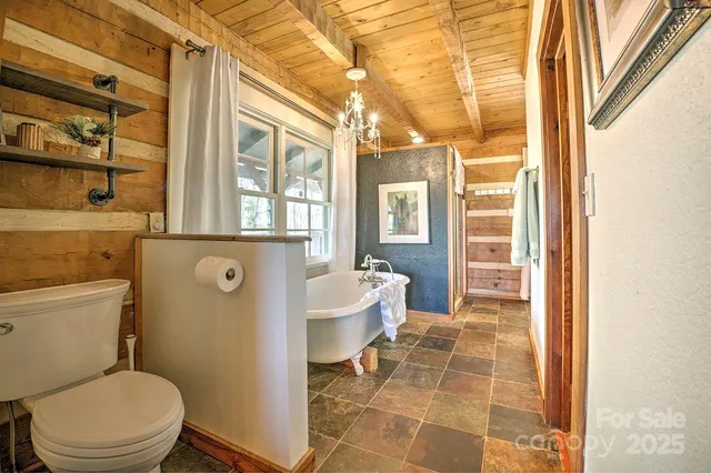 a bathroom with a toilet sink and shower