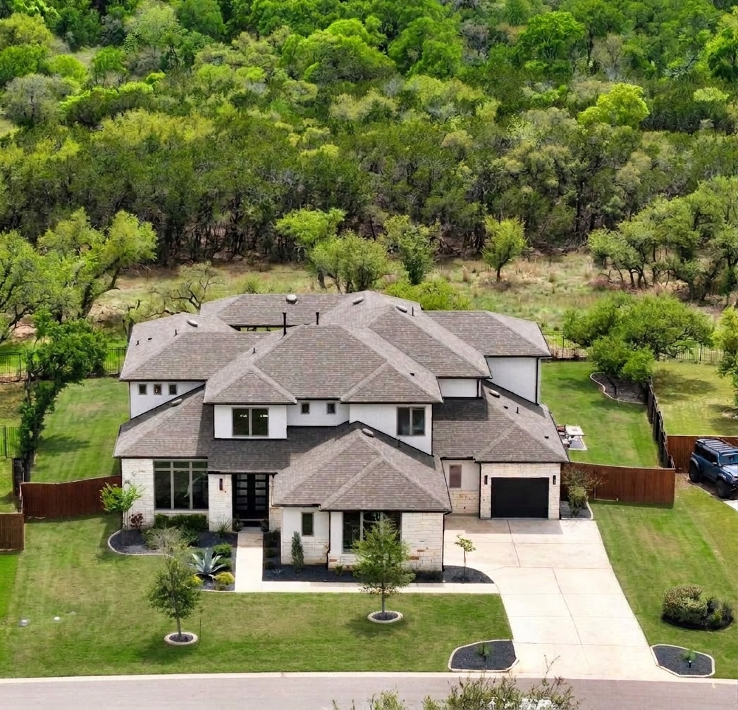 546 Bridge Water Loop Dripping Springs, TX 78620 - Photo 3 of 40 an aerial view of a house with yard patio and green space