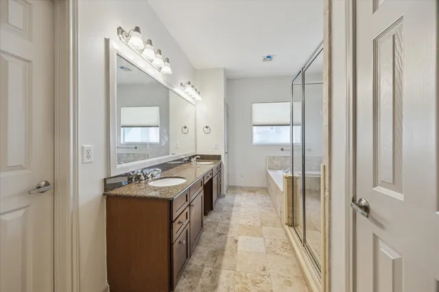 a kitchen with stainless steel appliances granite countertop a stove and a sink