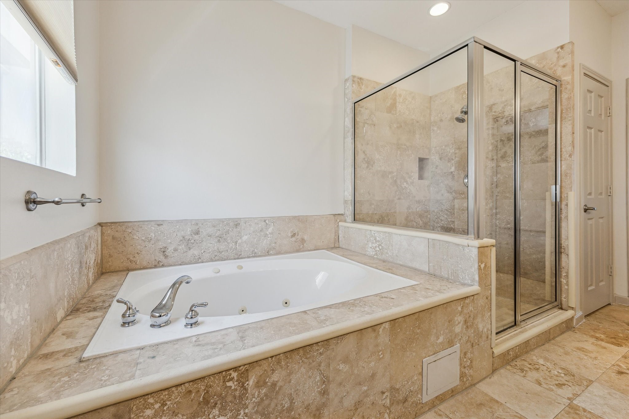 5334 Kiam Street, Unit C Houston, TX 77007 - Photo 16 of 23 a bathroom with a bathtub and a shower