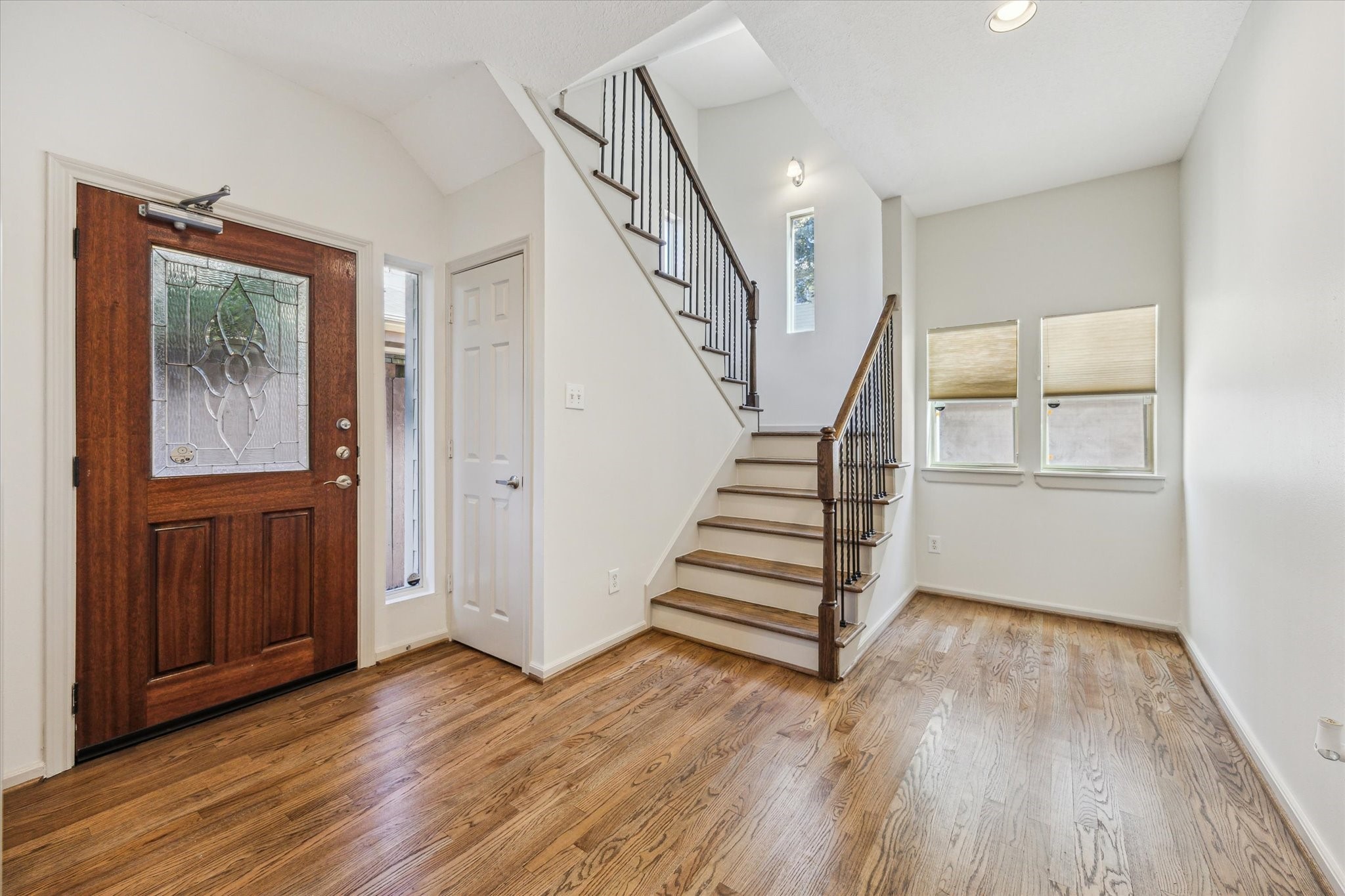 5334 Kiam Street, Unit C Houston, TX 77007 - Photo 3 of 23 a view of entryway with wooden floor and stairs