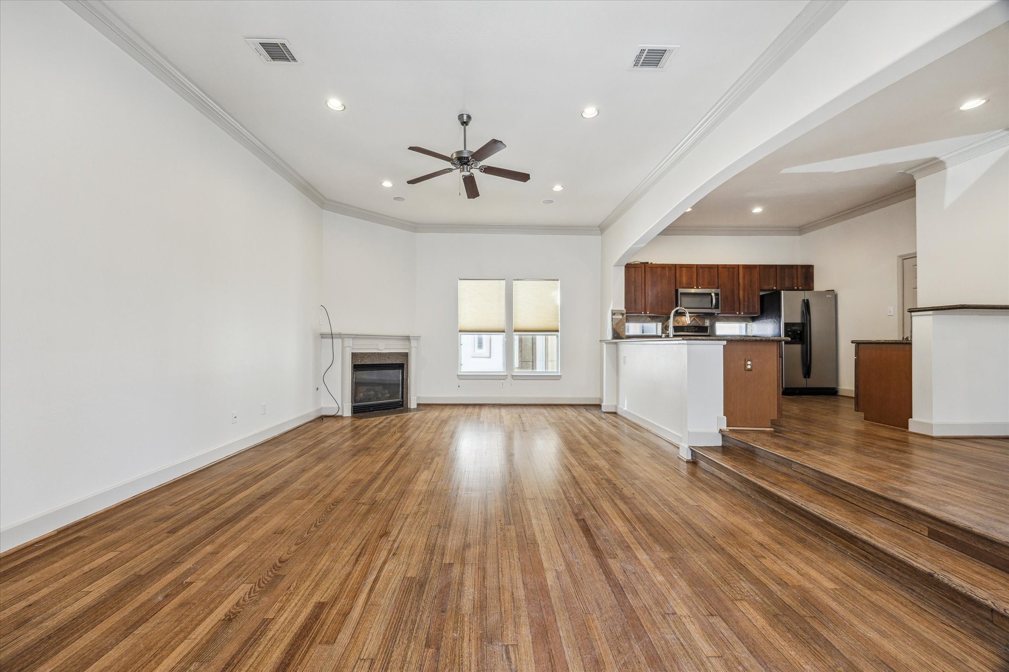 5334 Kiam Street, Unit C Houston, TX 77007 - Photo 8 of 23 a view of a kitchen with a sink and wooden floor