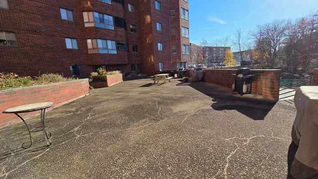 a view of a patio with a yard