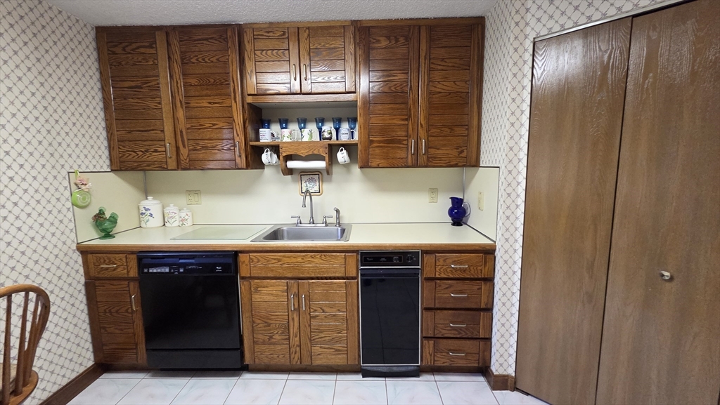 200 Burkhall Street, Unit 102 Weymouth, MA 02190 - Photo 7 of 25 a room with storage and utility