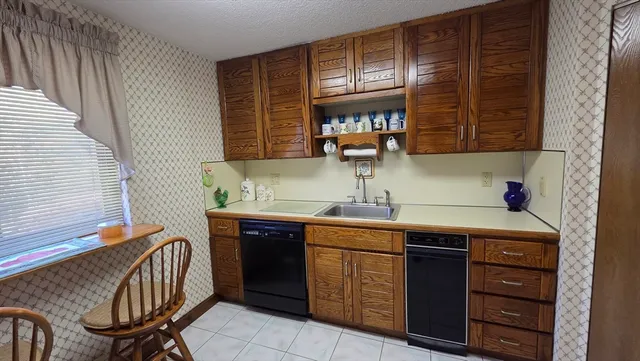 a kitchen with a sink and a stove